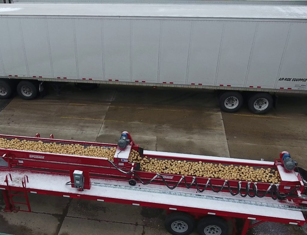 The 1400 – Dock Van Unloader filled with potatoes.