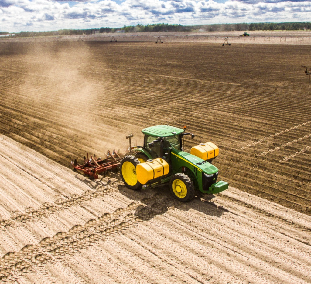 Spudnik's 4 Row Ridge Potato Hiller attached to a tractor.