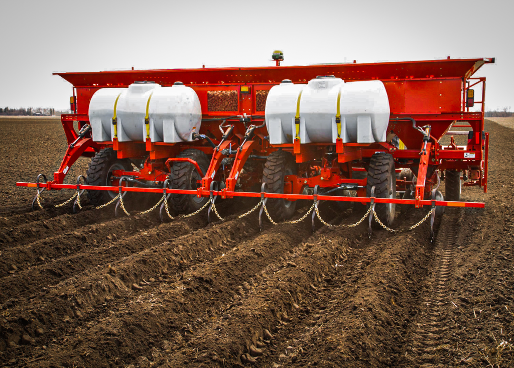 Spudnik's 8 Row Potato Planter at work in a farm.