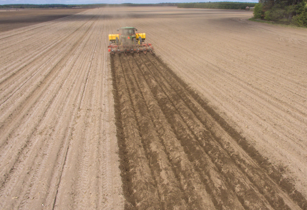 Spudnik's 8 Row Ridge Potato Hiller at work in a farm.