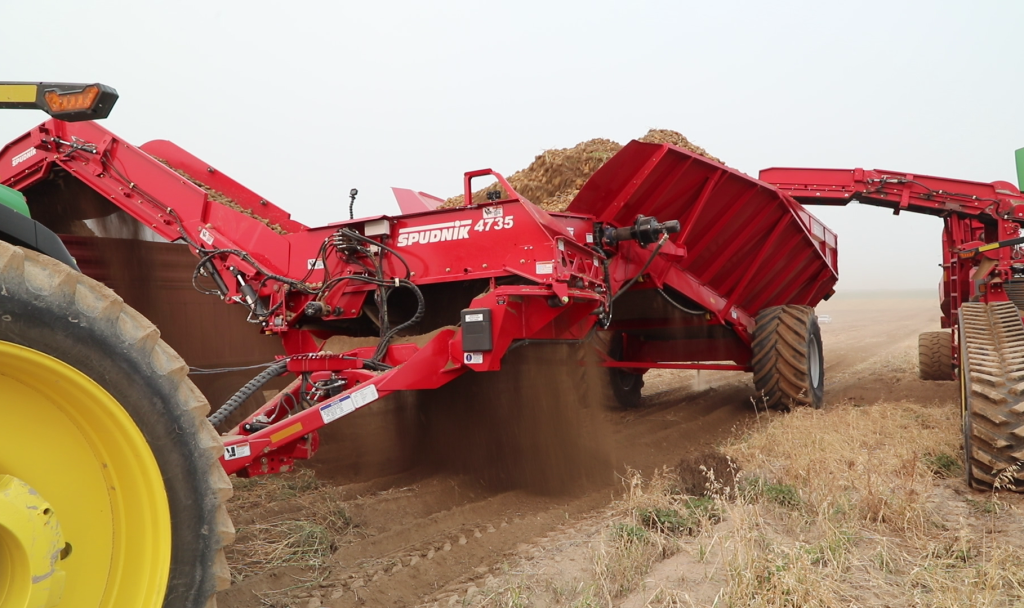 2 of Spudnik's 35 Ton Potato Cart being used in a farm.