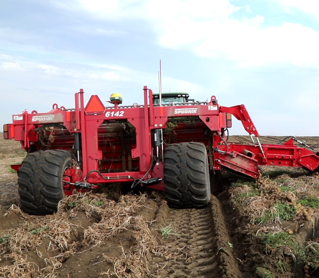 Piece of farming equipment on an open field