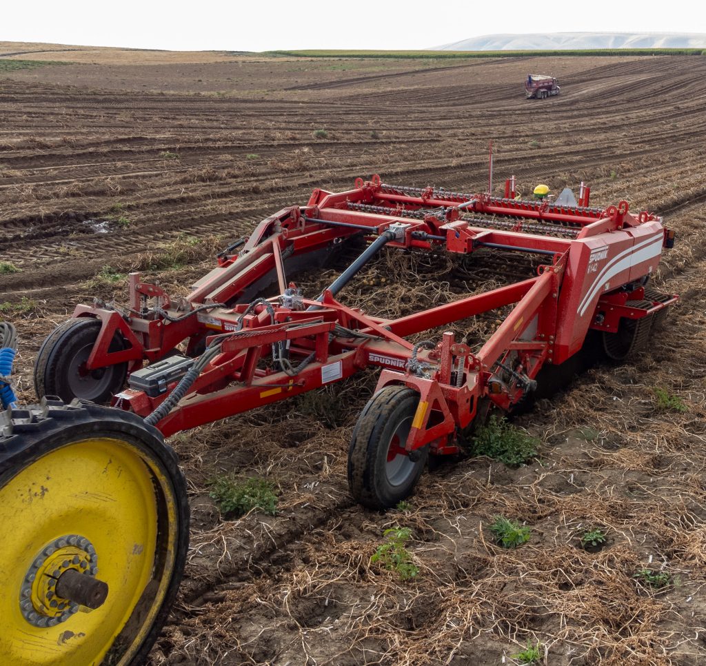 Piece of farming equipment on an open field